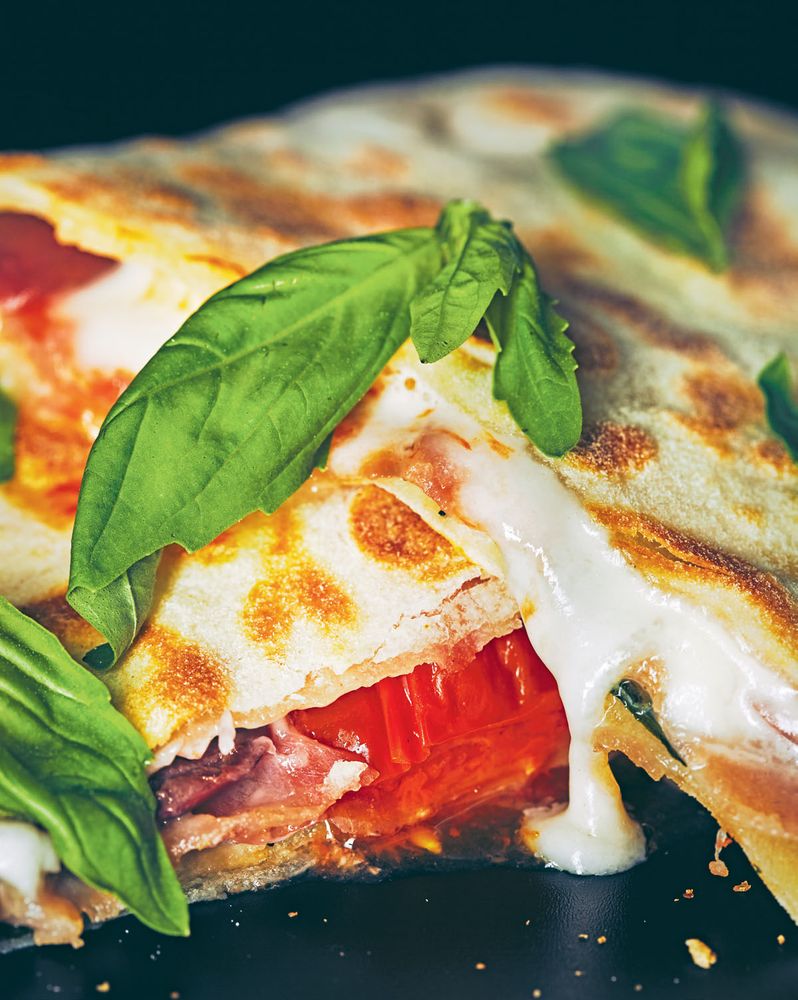 Taleggio, mozzarella, prosciutto, olive ± basil flatbreads from Chefs