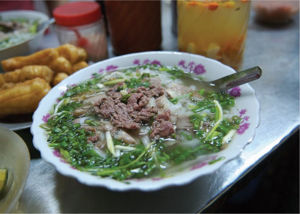 Aromatic Beef Broth with Rice Noodles, Shaved Onions, Lime Wedges and
