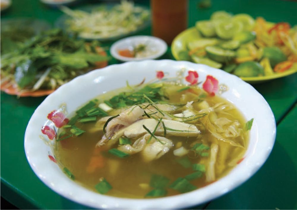 Aromatic Chicken Broth with Cellophane Noodles, Kaffir Lime Leaves and Fresh Herbs from Southeast As