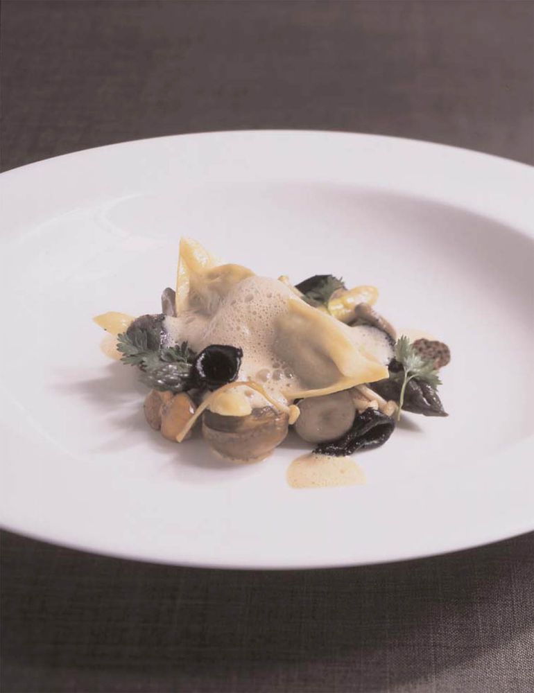 Wild Mushroom Ravioli with Asparagus Spears and Cep Cream Sauce from Season to Taste by Liam Tomlin
