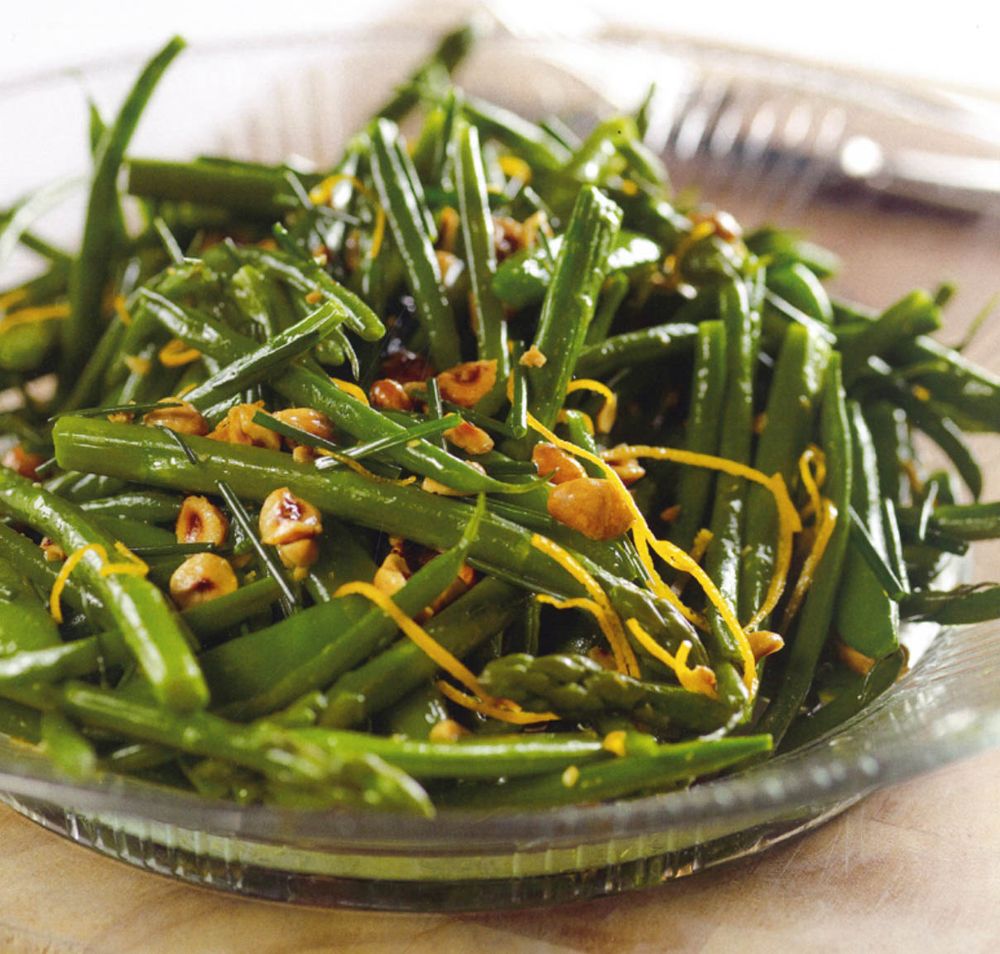 Asparagus, French beans and sugar snap peas with orange and hazelnuts
