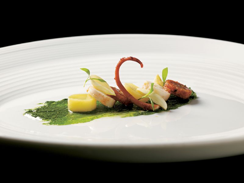 Grilled Octopus Tentacles, Chorizo, Fingerling Potatoes, Green Almonds, and Salsa Verde from Under P